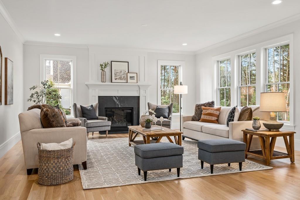 5 Stone Ridge Lane Weston, MA 02493 - Photo 9 of 40 a living room with furniture and a fireplace