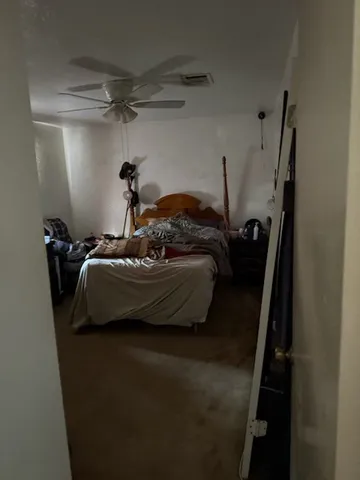 a bed room with furniture and a window