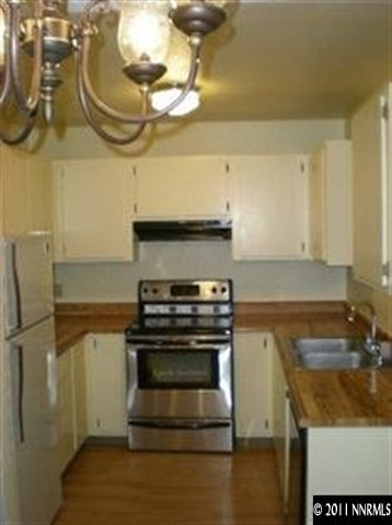 2080 Highview Court, Unit 5 Reno, NV 89512 - Photo 2 of 9 a kitchen with a stove and a sink