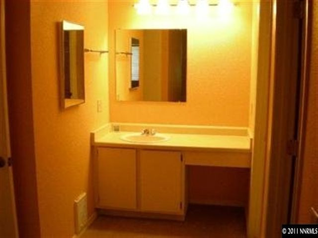 2080 Highview Court, Unit 5 Reno, NV 89512 - Photo 4 of 9 a bathroom with a sink and a mirror