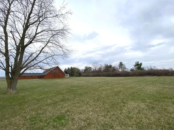 a view of a backyard with sitting area