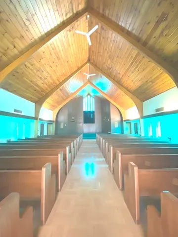 a view of an empty room and a window