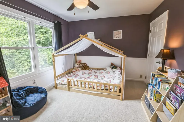 a dining room with wooden floor and entrance