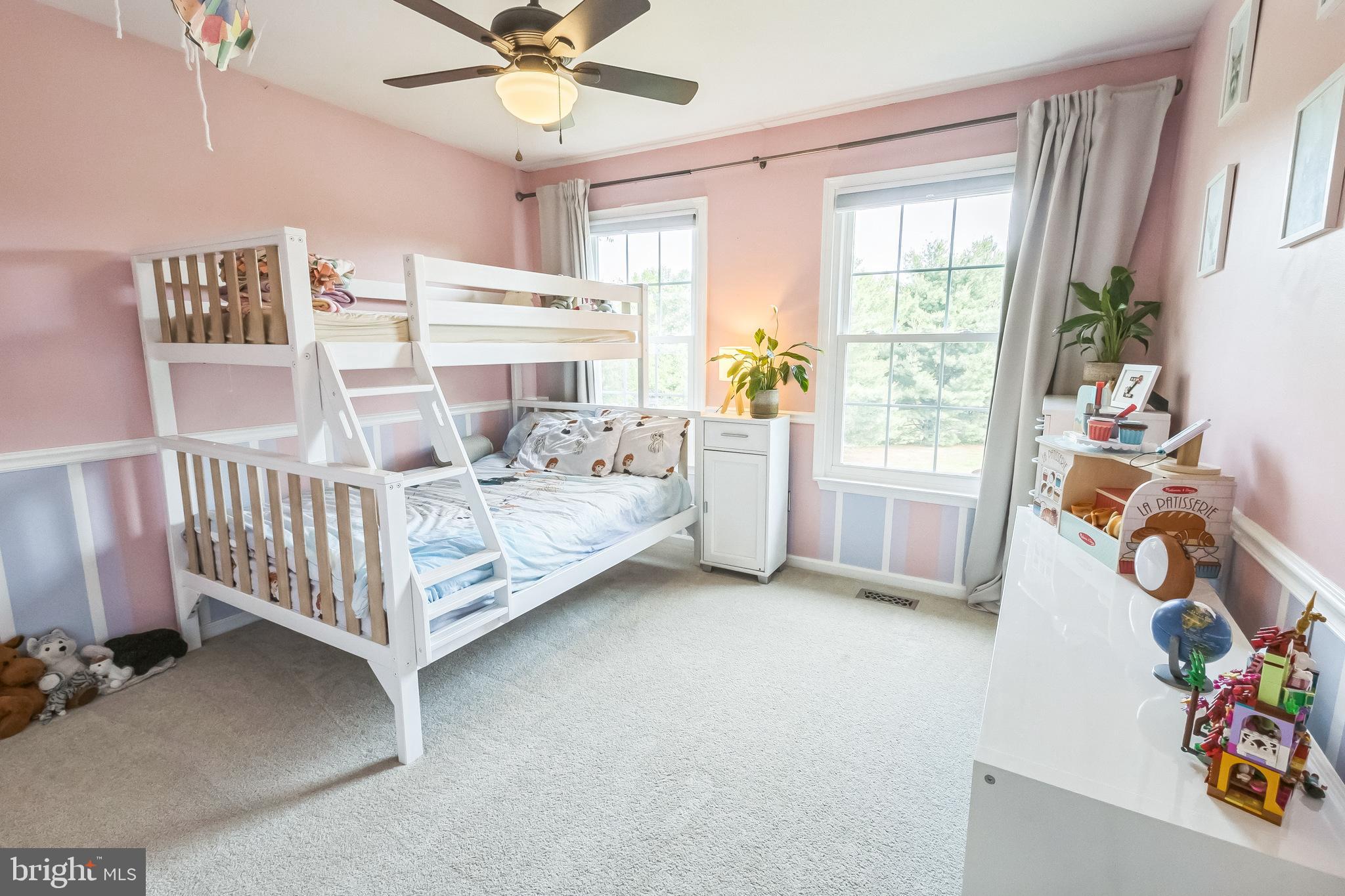 26 Emerald Ridge Drive Bear, DE 19701 - Photo 21 of 35 Charming pink bedroom accented w/ chair rail trim.