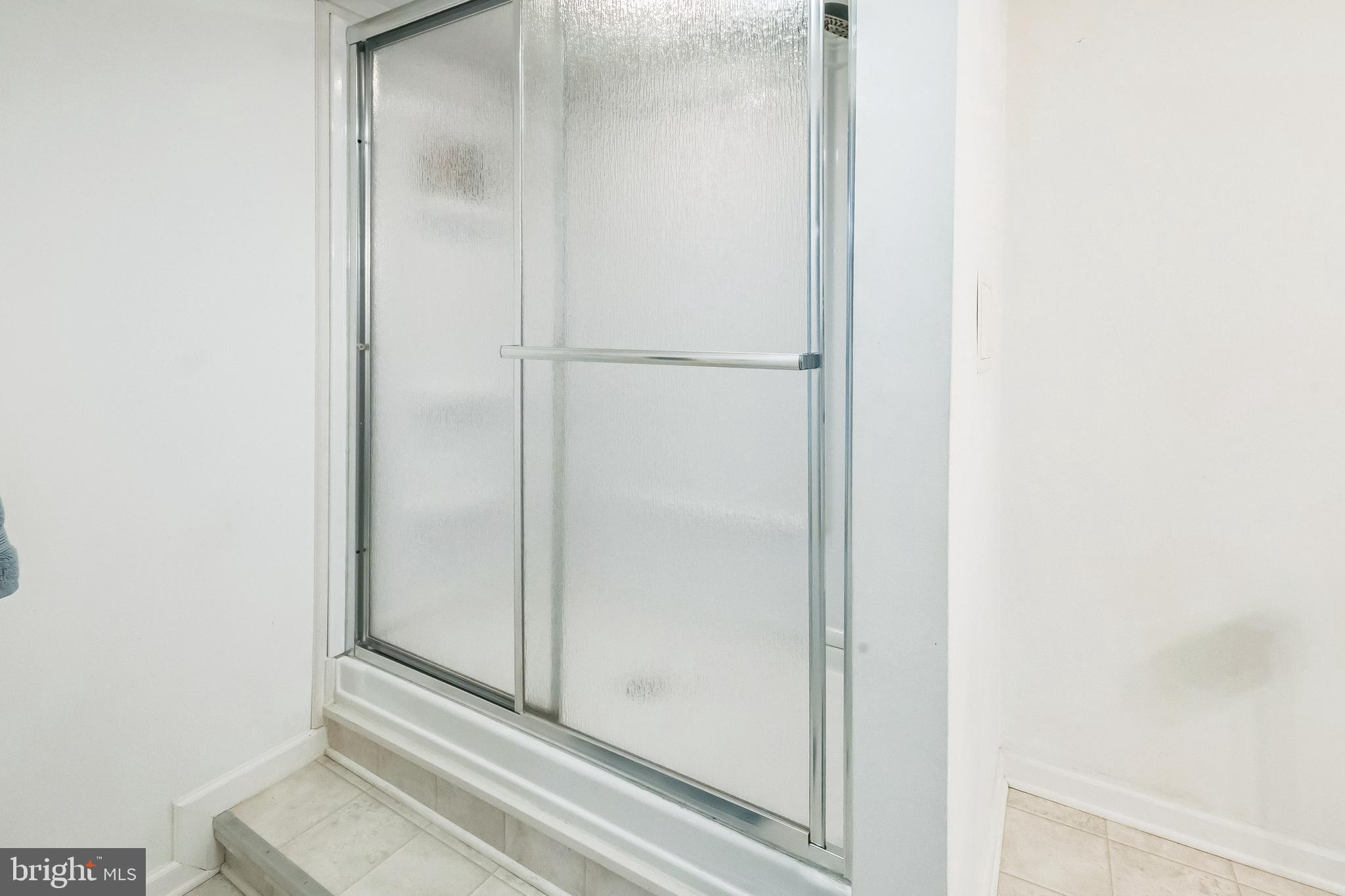 26 Emerald Ridge Drive Bear, DE 19701 - Photo 25 of 35 Sleek shower enclosure located in full bathroom.