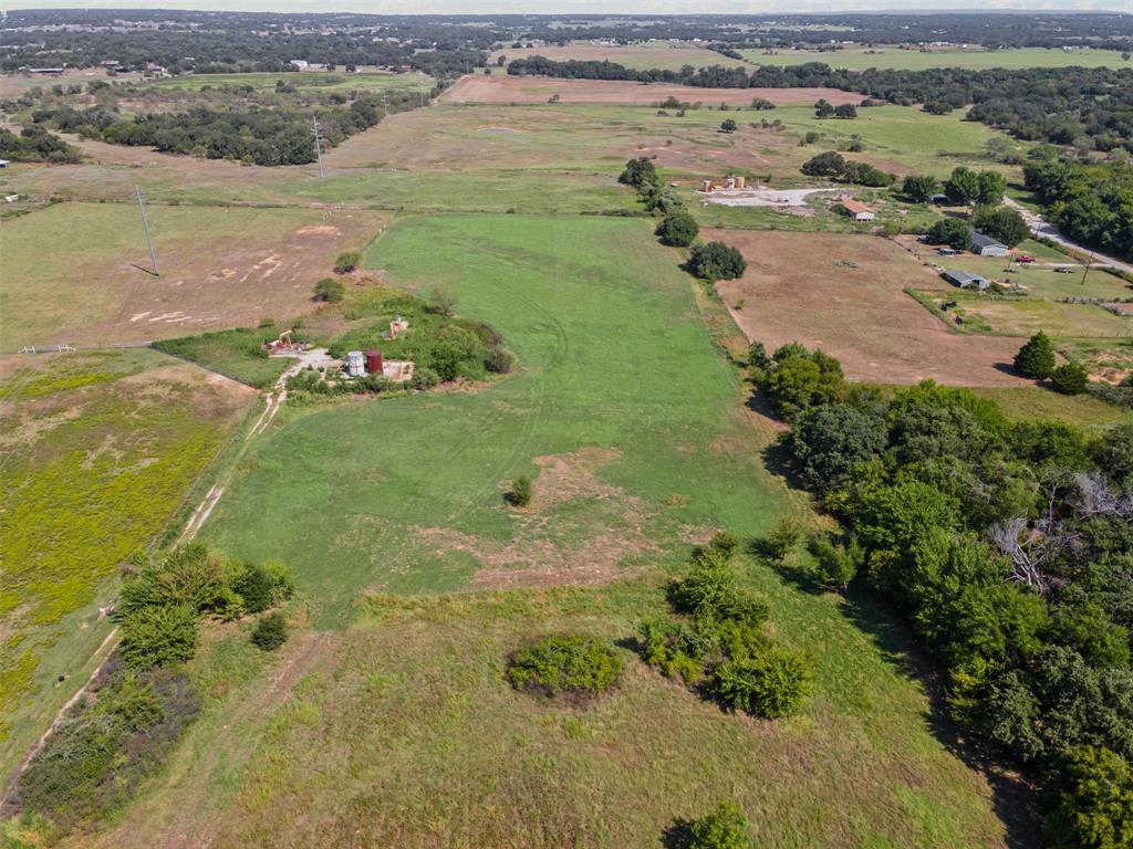 Tbd Springfield Road Springtown, TX 76082 - Photo 12 of 20 an aerial view of a houses with outdoor space