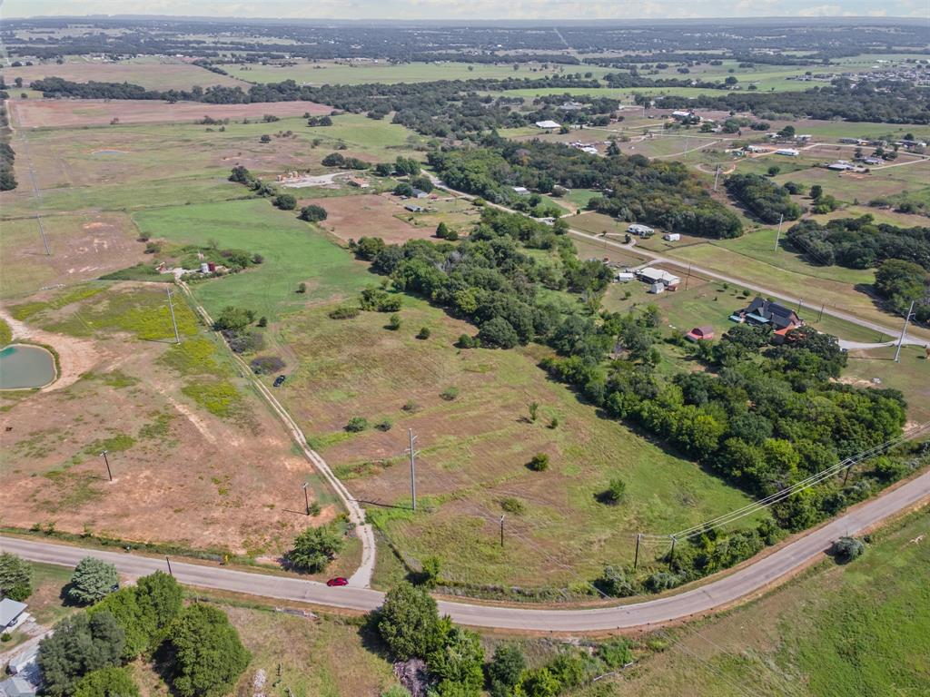 Tbd Springfield Road Springtown, TX 76082 - Photo 10 of 20 an aerial view of a house with a yard and lake view