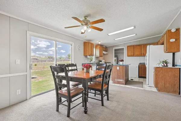 a view of a dining room with furniture window and outside view