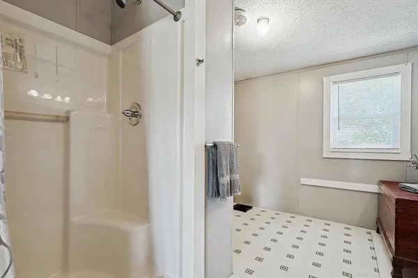 a bathroom with a bathtub and a shower