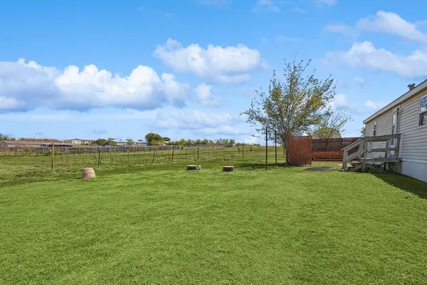 a view of a house with a big yard