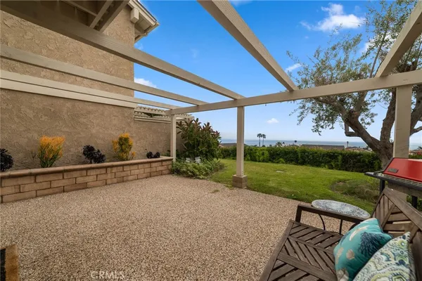 a outdoor space with a couch and the potted plant