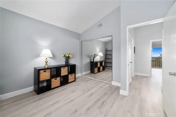 a view of living room and wooden floor