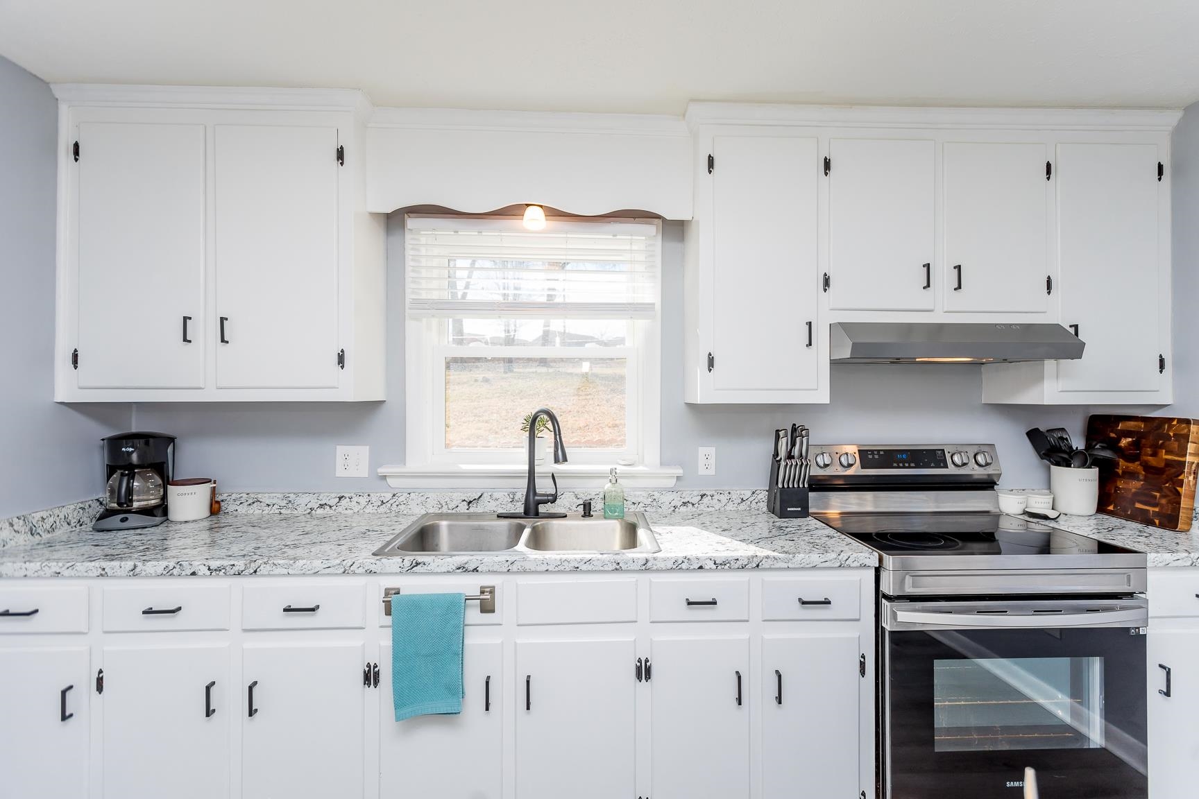 170 Quick's Mill Road Verona, VA 24482 - Photo 18 of 45 a kitchen with granite countertop white cabinets and white appliances