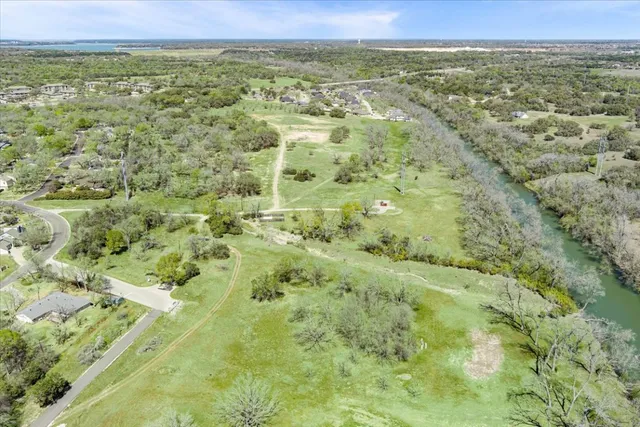 a view of a lake with a yard
