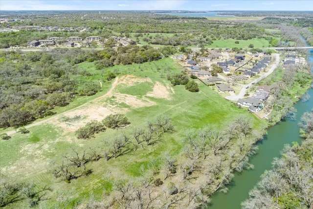 a view of grassy field with mountain