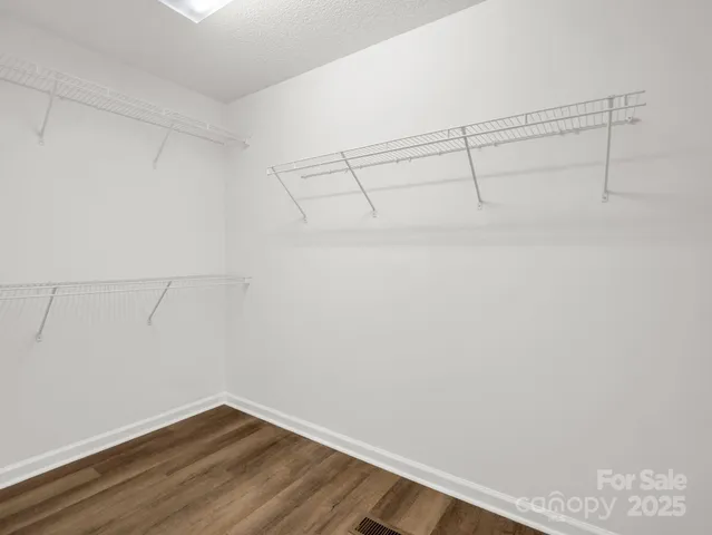 a view of a room with racks on the wall