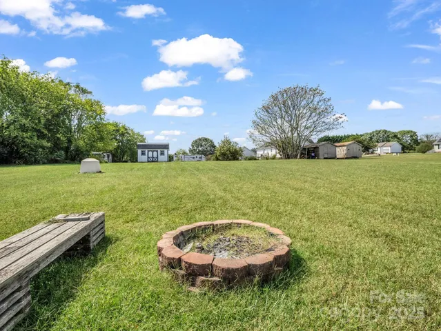 a view of a swimming pool with a yard
