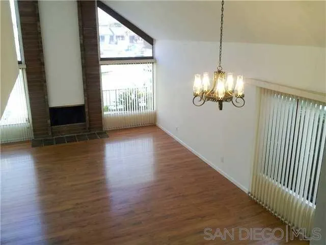 40 Green Turtle Road Coronado, CA 92118 - Photo 3 of 11 a view of empty room with wooden floor and fan