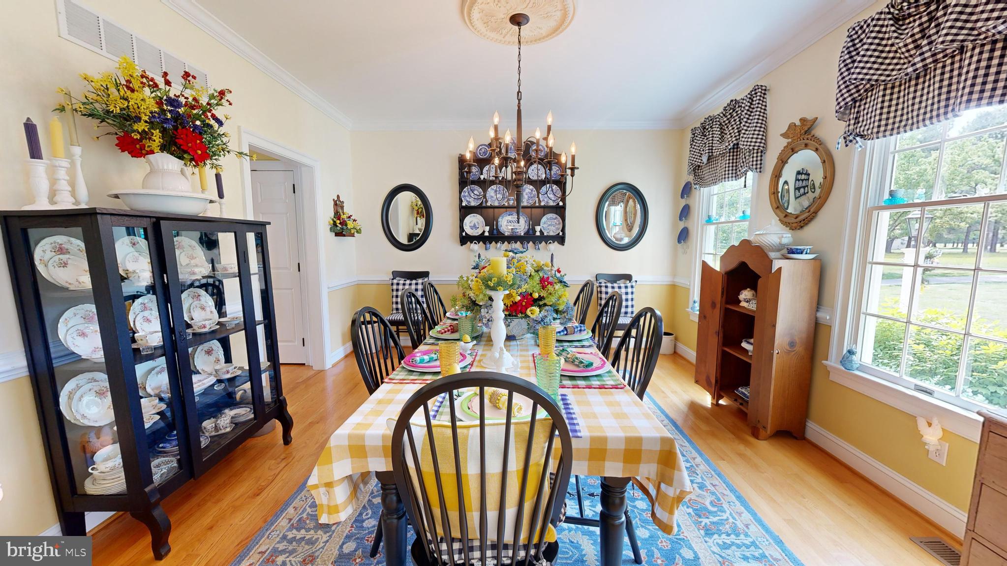 28028 Playtor Road Easton, MD 21601 - Photo 16 of 80 a view of a dining room with furniture wooden floor and front door