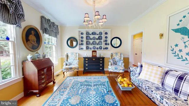 a spacious bedroom with a bed and wooden floor