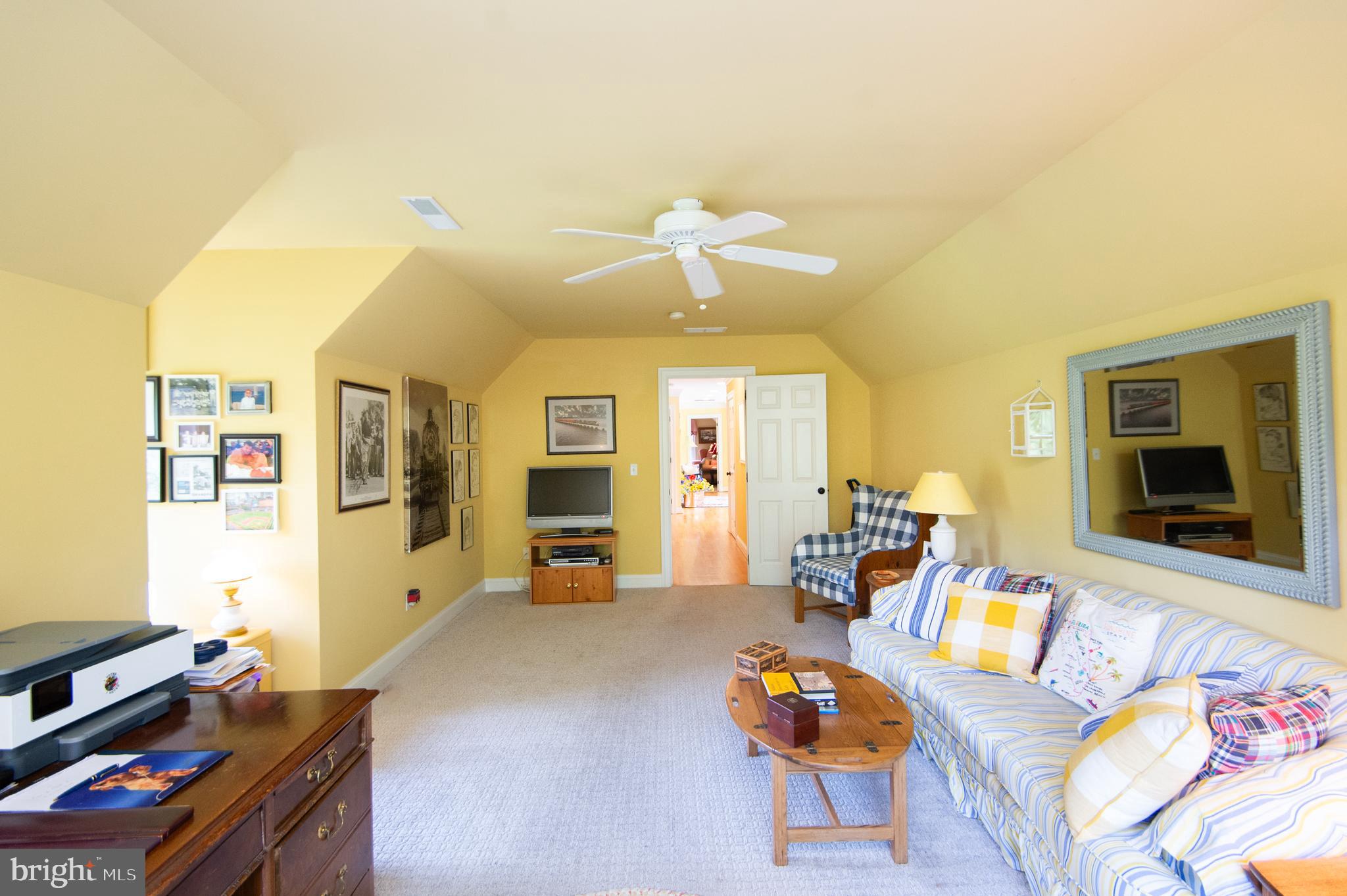 28028 Playtor Road Easton, MD 21601 - Photo 50 of 80 a living room with furniture and a flat screen tv
