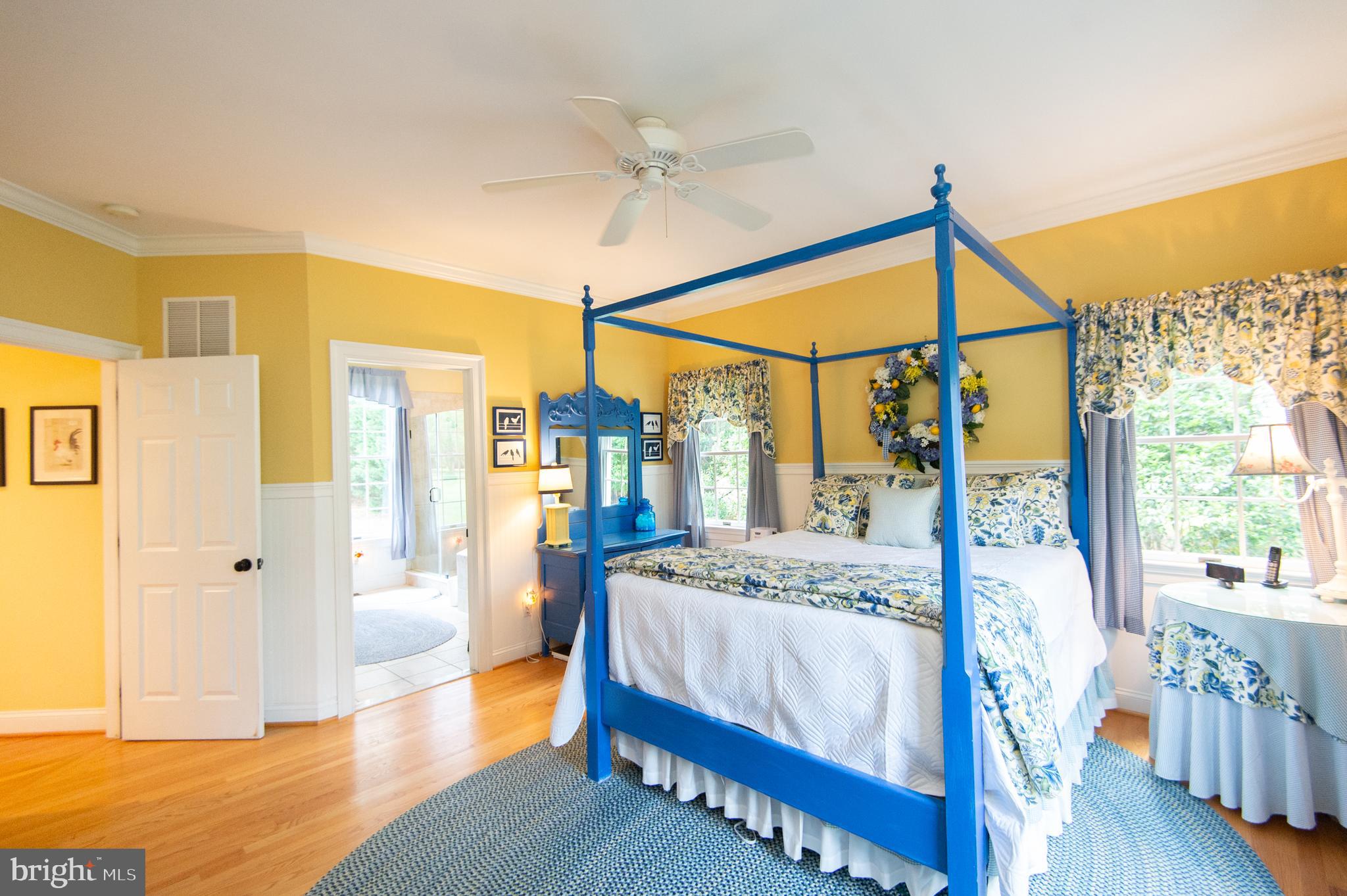28028 Playtor Road Easton, MD 21601 - Photo 5 of 80 a spacious bedroom with a bed and wooden floor