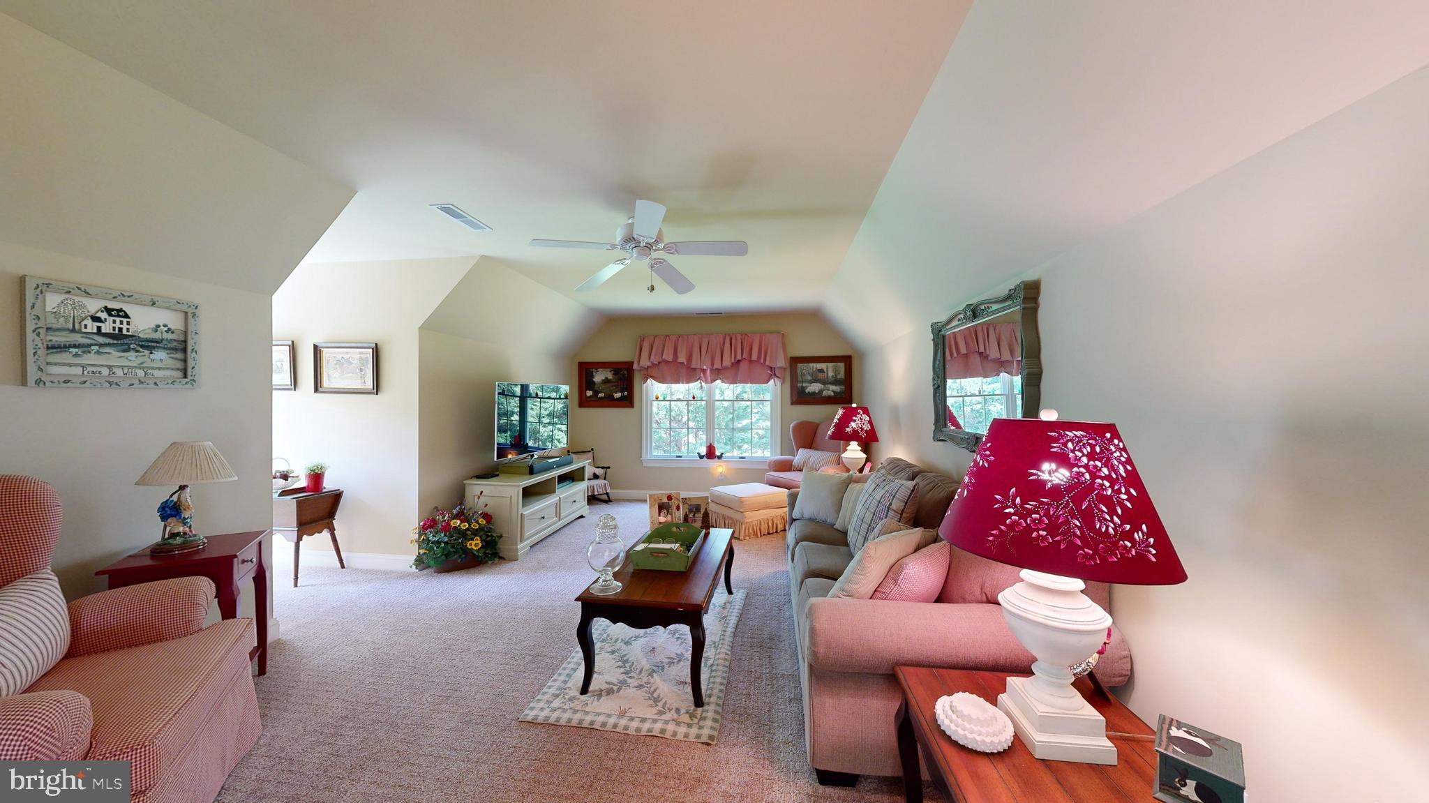 28028 Playtor Road Easton, MD 21601 - Photo 56 of 80 a living room with furniture and a large window