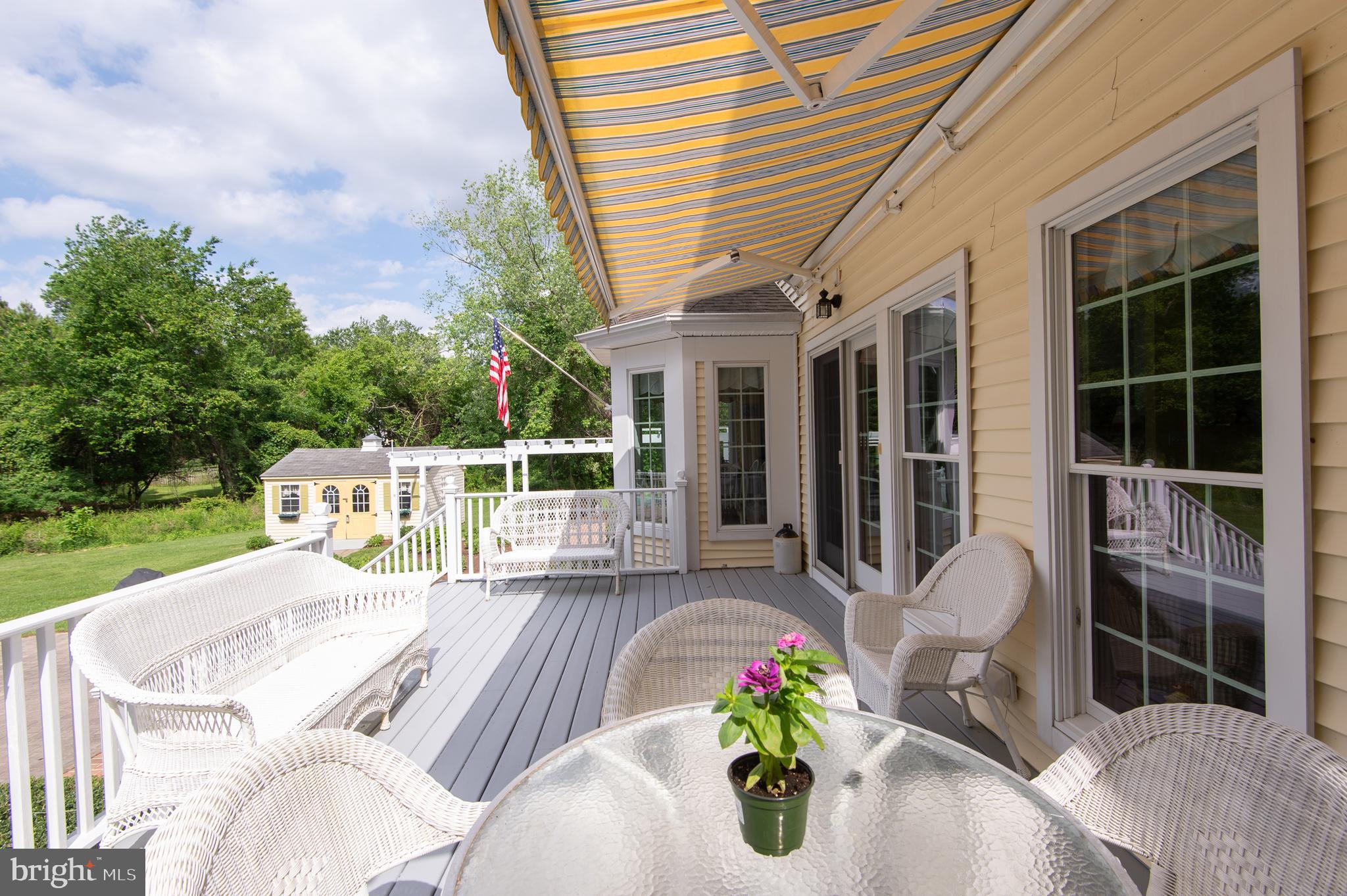 28028 Playtor Road Easton, MD 21601 - Photo 64 of 80 a view of a chair and table in the patio