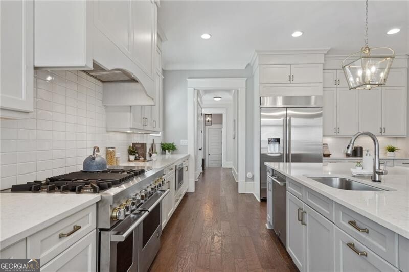 3185 Casteel Road Marietta, GA 30062 - Photo 11 of 20 a kitchen with kitchen island a sink stove and refrigerator
