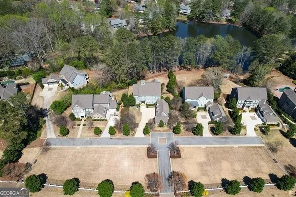 an aerial view of residential houses with outdoor space