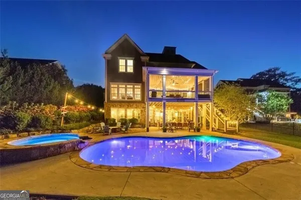 a swimming pool with yard in front of it