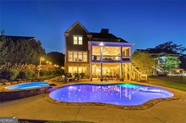 a swimming pool with yard in front of it