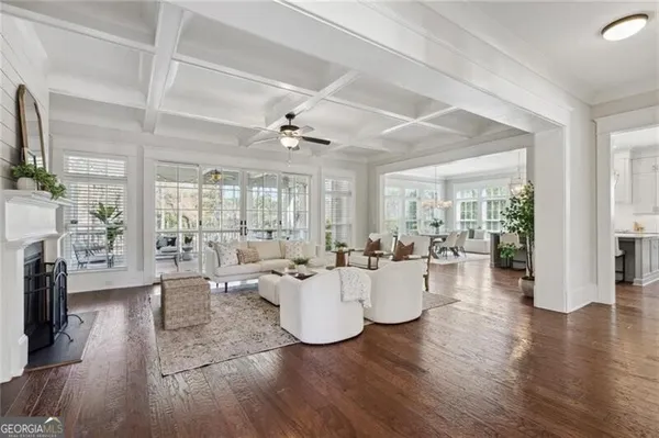 a living room with fireplace furniture and a flat screen tv