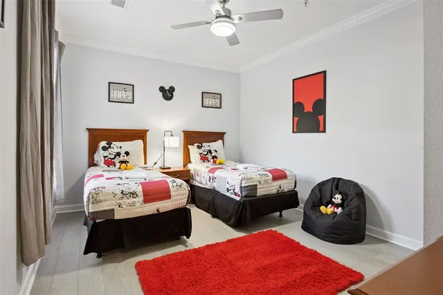 a bed room with two bed and a window