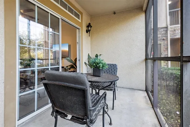 a view of a vase of flowers sitting on a dining table