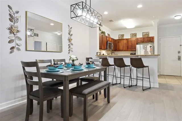 a kitchen with stainless steel appliances granite countertop a sink and cabinets