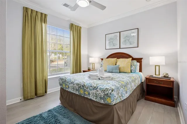 a bedroom with a bed and a mirror