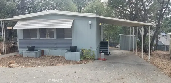 a backyard of a house with seating space