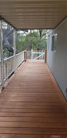 a view of a porch with wooden floor
