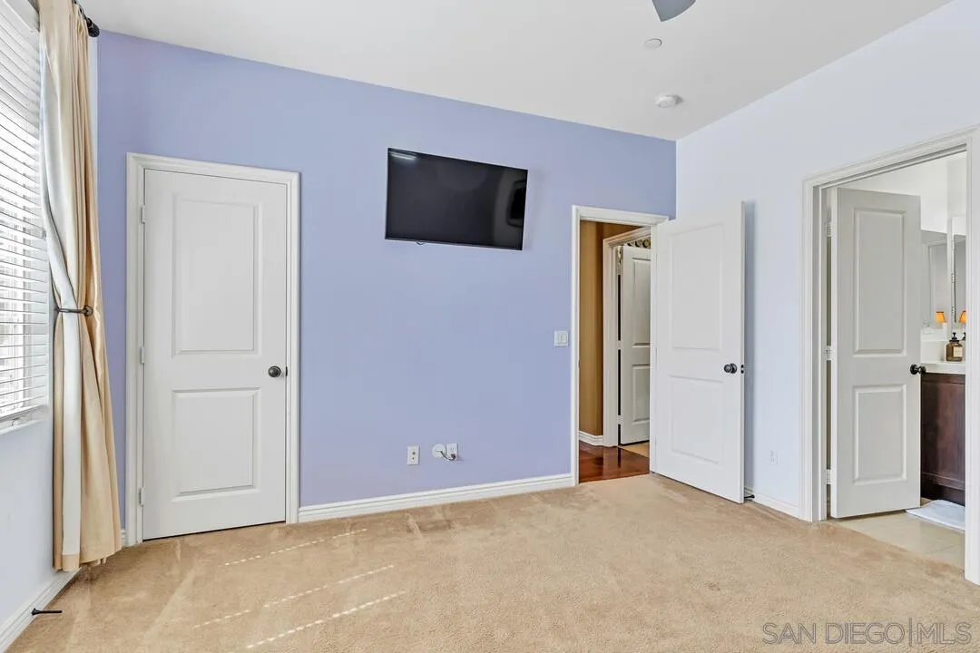 14622 Whispering Ridge Road San Diego, CA 92131 - Photo 12 of 75 a view of an empty room with closet and a window