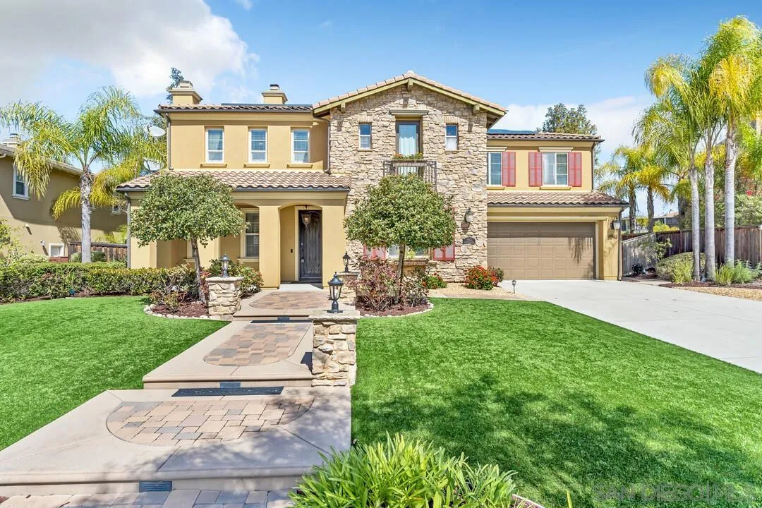 14622 Whispering Ridge Road San Diego, CA 92131 - Photo 2 of 75 a front view of a house with a yard