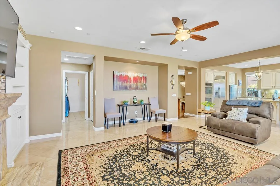 14622 Whispering Ridge Road San Diego, CA 92131 - Photo 24 of 75 a living room with furniture and a large window
