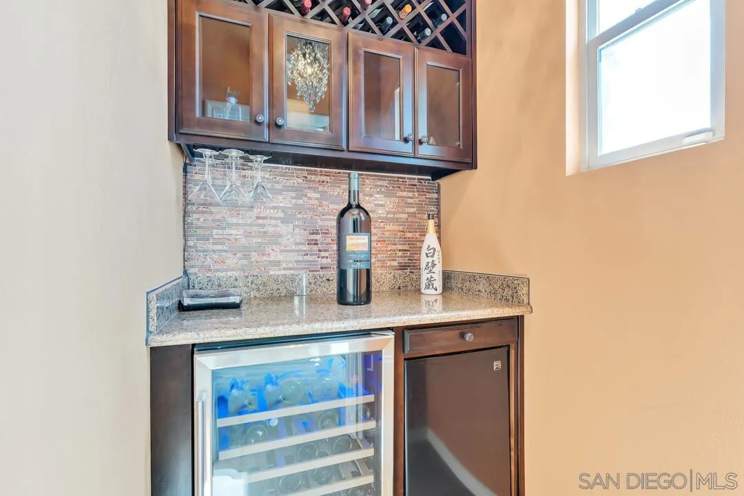 14622 Whispering Ridge Road San Diego, CA 92131 - Photo 30 of 75 a kitchen with a sink and cabinets