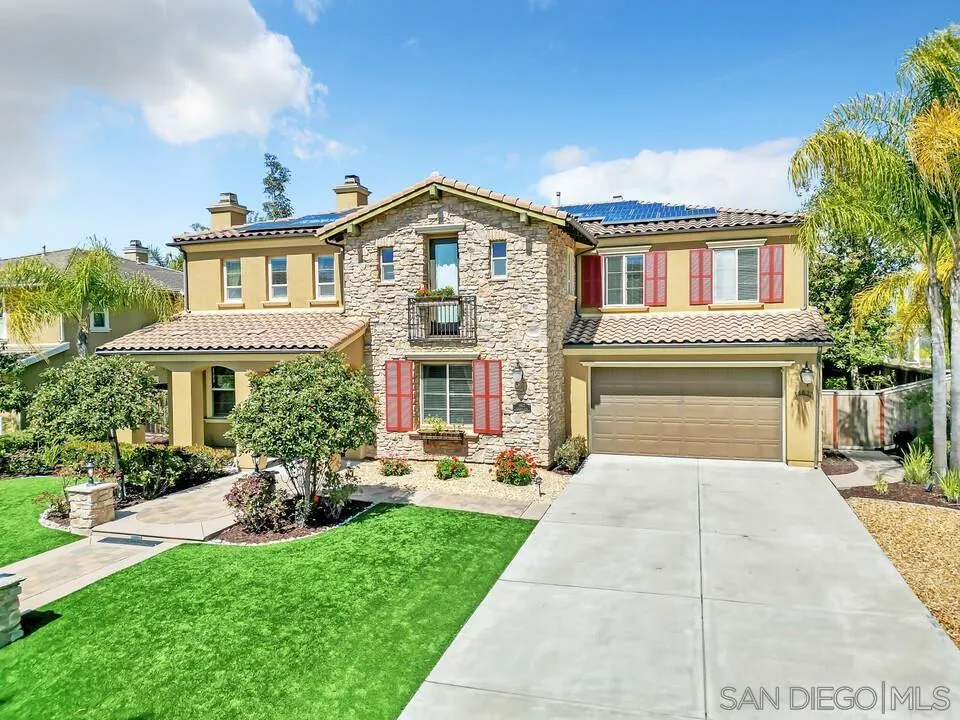 14622 Whispering Ridge Road San Diego, CA 92131 - Photo 3 of 75 a front view of a house with garden