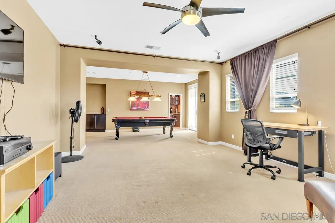 14622 Whispering Ridge Road San Diego, CA 92131 - Photo 31 of 75 a view of a livingroom with furniture and a window