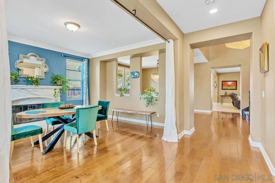 14622 Whispering Ridge Road San Diego, CA 92131 - Photo 4 of 75 a view of a dining room with furniture one side kitchen view
