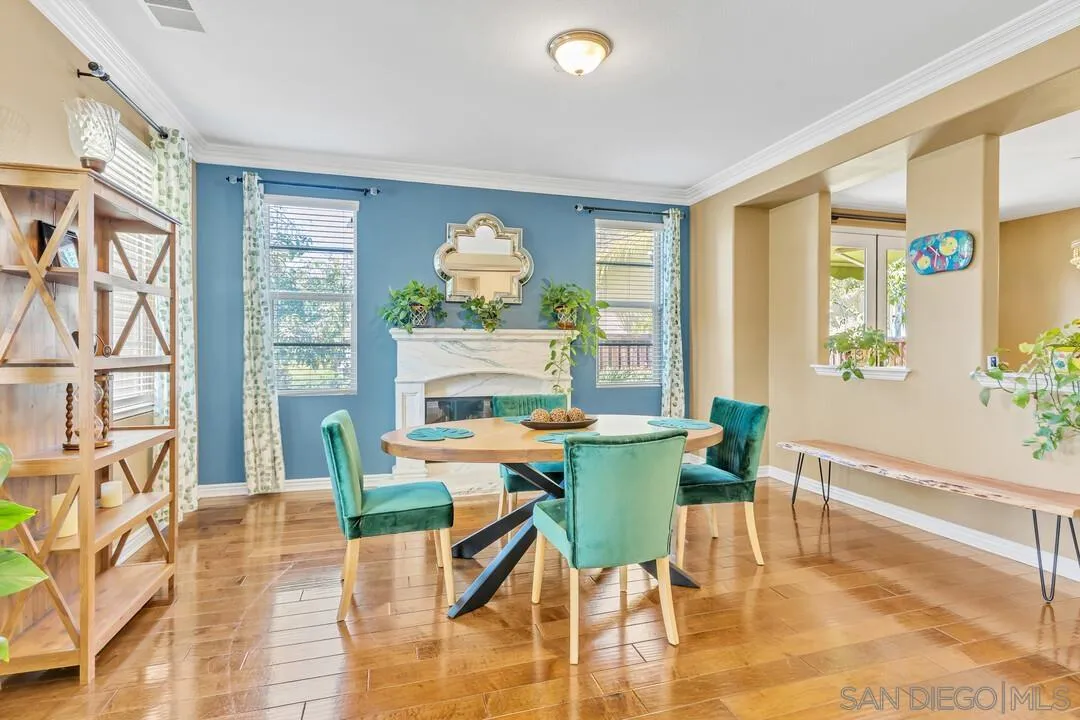 14622 Whispering Ridge Road San Diego, CA 92131 - Photo 5 of 75 a view of a dining room with furniture and a large window