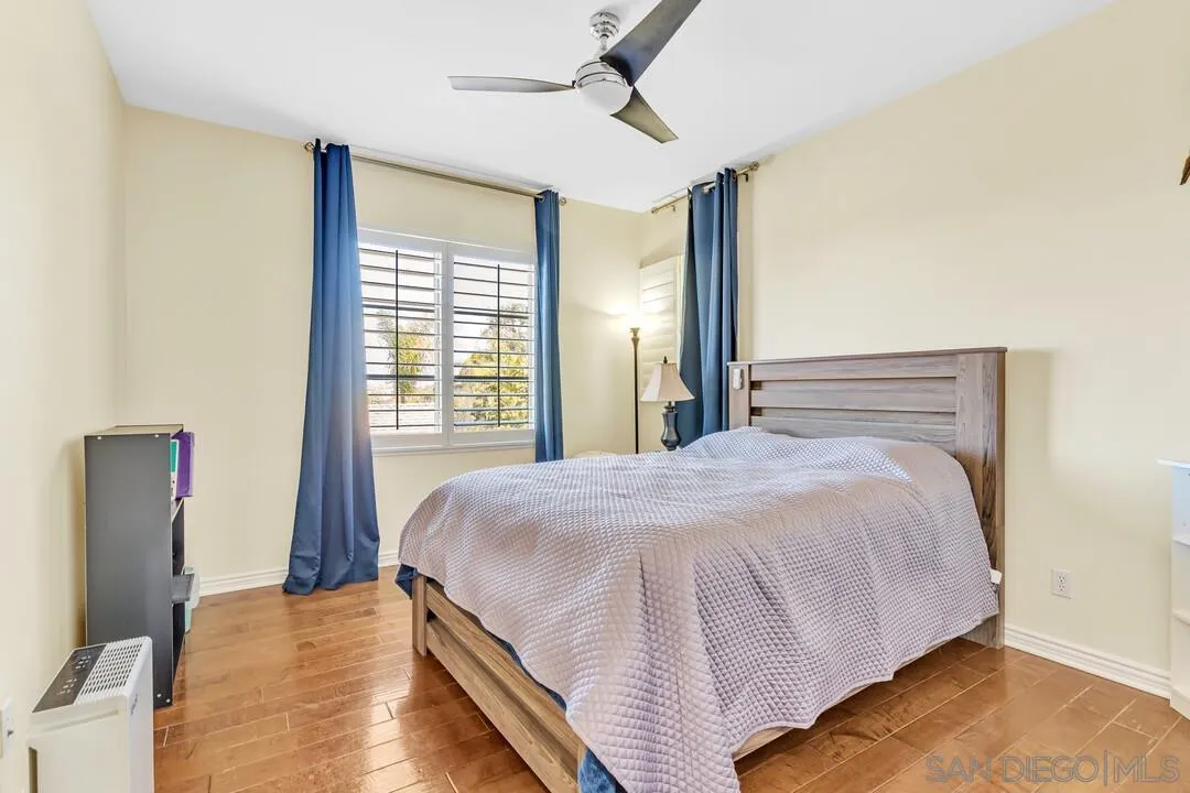 14622 Whispering Ridge Road San Diego, CA 92131 - Photo 51 of 75 a large bed sitting in a bedroom next to a window