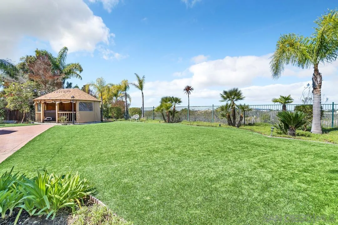 14622 Whispering Ridge Road San Diego, CA 92131 - Photo 65 of 75 a front view of house with yard and green space
