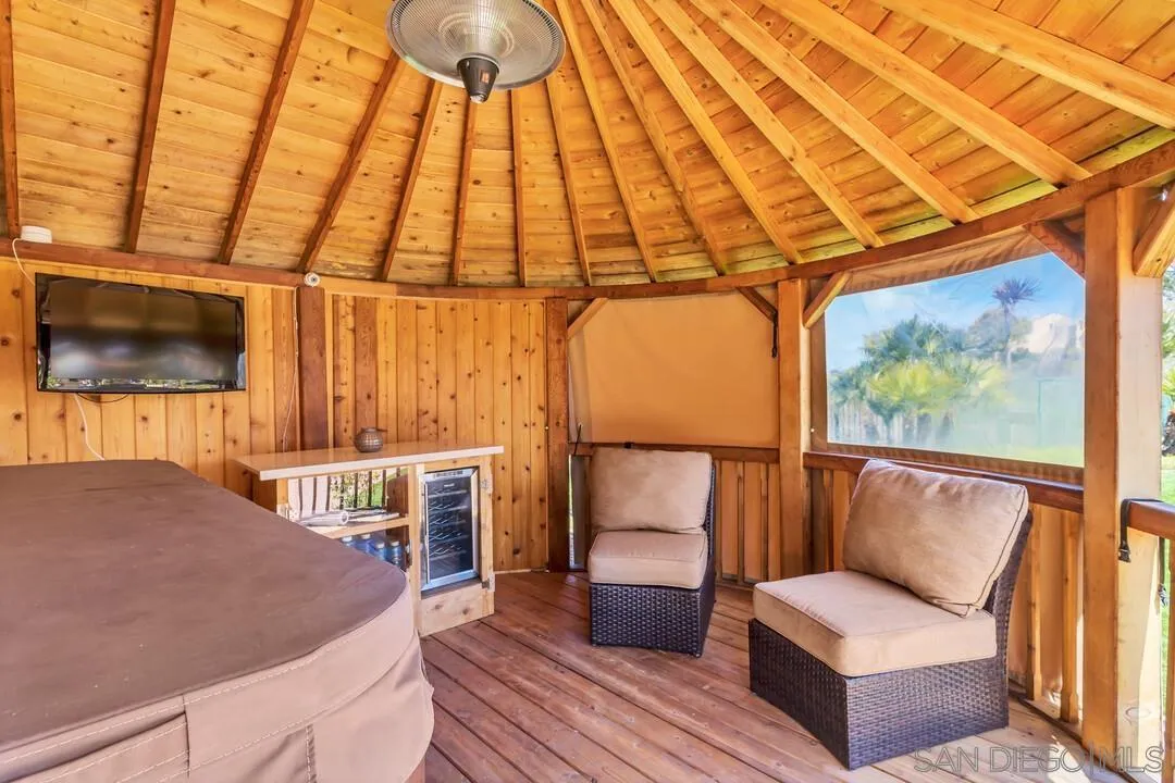 14622 Whispering Ridge Road San Diego, CA 92131 - Photo 70 of 75 a living room with furniture and a flat screen tv